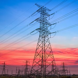 electricity pylons in transformer substation with a beautiful sunset sky