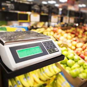 Retail Store Electronic Weighing Scales and the Store Fresh Products in the Background