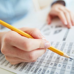 Close-up image of a financial worker analyzing statistical data