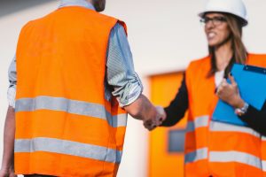 consultant shaking site manager hand